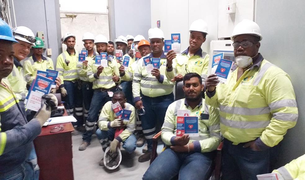 Above and below: Team TGI proudly displaying the Heart Healthy
brochure